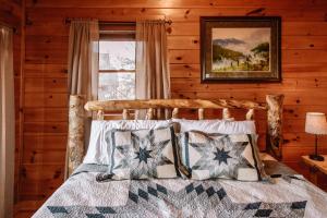 a bedroom with a bed and a window at Expansive Mountain Views, Theater, Games, Hot Tub, Relaxing porches in Sevierville
