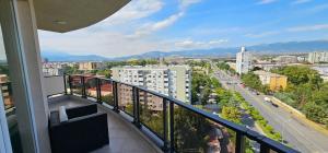 a balcony with a view of a city at Mr.-Legend's Penthouse in Skopje
