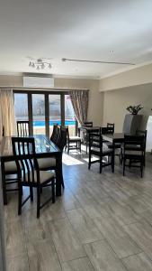 a dining room with a table and some chairs at RNB Guesthouse in Roodepoort