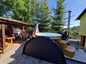 a tent is sitting on the ground in a yard at Cabana Muntelui in Cluj-Napoca