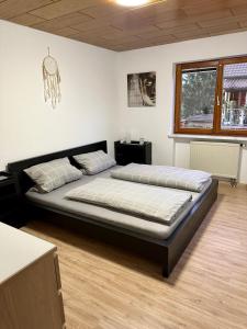a bedroom with two beds in a room at Casa Elio in Kappel-Grafenhausen