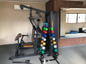 a room with a gym with a bunch of balls at Flat Versatti - Próximo Real Hospital Port e Pólo Médico Ilha do Leite in Recife