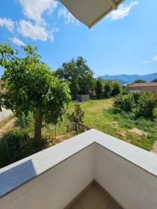 a balcony with a view of a tree at Central apartment in Prilep in Prilep