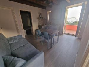 a living room with a couch and a table at Residence Mirella in Acquafredda
