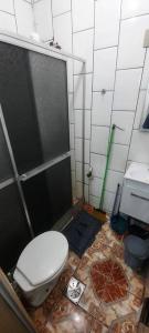 a bathroom with a toilet and a shower stall at STUDIO NITERÓI-BARCAS in Niterói