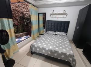 Postel nebo postele na pokoji v ubytování Hospedaje Casa Aurora
