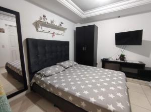 Postel nebo postele na pokoji v ubytování Hospedaje Casa Aurora