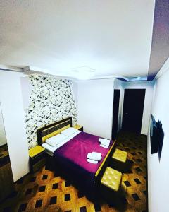 Postel nebo postele na pokoji v ubytování Georgian Palace Hotel
