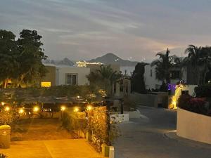 a view of a garden at night with lights at Sea view, king-size bed, wheelchair access in Cabo San Lucas