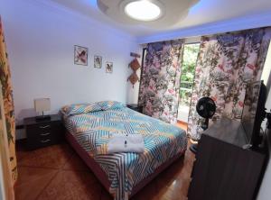Postel nebo postele na pokoji v ubytování Hospedaje Casa Aurora