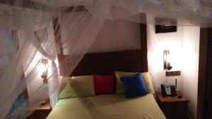 Ein Bett oder Betten in einem Zimmer der Unterkunft GAYA HOMESTAY