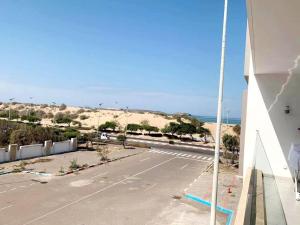 an empty street in front of a building at Appartement Les bienvenus in Essaouira