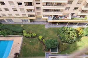 布宜諾斯艾利斯的住宿－Madero Homes / 3amb /piscina / balcón / lavadero，享有大楼花园的空中景致