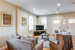 a living room with couches and a flat screen tv at Beautiful Farmhouse close to Lanc Hershey Etown in Mount Joy