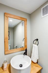a bathroom with a white sink and a mirror at Beautiful Farmhouse close to Lanc Hershey Etown in Mount Joy +23 photos