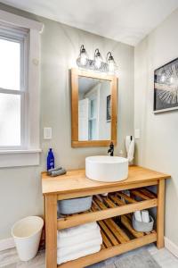 a bathroom with a sink and a mirror at Beautiful Farmhouse close to Lanc Hershey Etown in Mount Joy