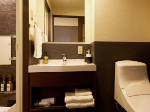 a bathroom with a sink and a toilet at Waka Heian Shirakawa Hotel in Kyoto +37 photos