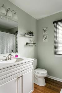 a white bathroom with a sink and a toilet at 1 Bed with Private Bathroom Close to Everything in Newark & Wilmington in Newark