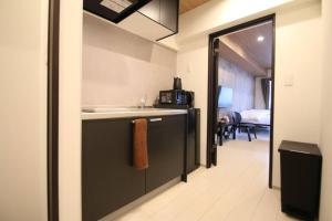 a kitchen with a sink and a counter top at リブレ in Kumamoto 201 in Kumamoto