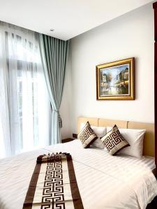 Postel nebo postele na pokoji v ubytování Thành Công Hotel