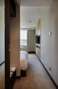 Postel nebo postele na pokoji v ubytování K Hotel Tianjin