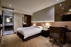 Postel nebo postele na pokoji v ubytování K Hotel Tianjin