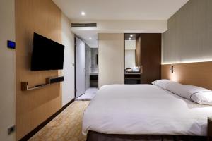 Postel nebo postele na pokoji v ubytování K Hotel Tianjin