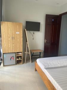 Postel nebo postele na pokoji v ubytování Hoàng Sang