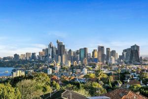a cityscape of a city with tall buildings at HARIS - Modern 2BR Apartment with Views in Sydney