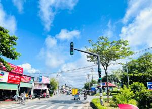 a green traffic light on a city street at Homestay Dương Đông Town in Phu Quoc