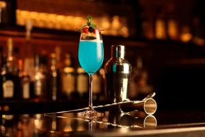 a blue drink in a martini glass on a bar at Hotel Nikko Kanazawa in Kanazawa