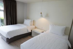 LeBlanc Hotel tesisinde bir odada yatak veya yataklar
