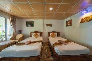 Voodi või voodid majutusasutuse Tongta Phaview Resort toas