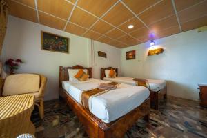Voodi või voodid majutusasutuse Tongta Phaview Resort toas