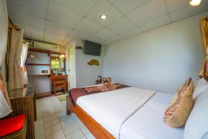 Voodi või voodid majutusasutuse Tongta Phaview Resort toas