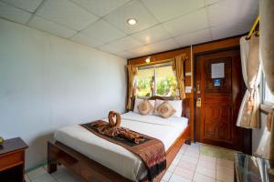 Voodi või voodid majutusasutuse Tongta Phaview Resort toas