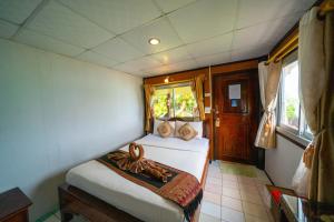 Voodi või voodid majutusasutuse Tongta Phaview Resort toas