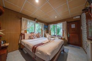 Voodi või voodid majutusasutuse Tongta Phaview Resort toas