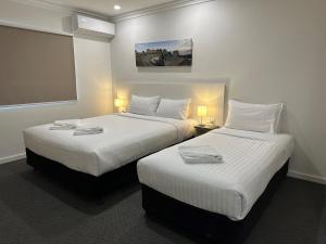 Postel nebo postele na pokoji v ubytování Golf View Motel