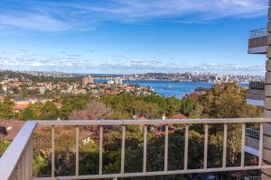 a balcony with a view of the city and water at CRE31 - renovated 1 bedroom unit - Cremorne in Sydney