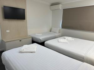 Postel nebo postele na pokoji v ubytování Golf View Motel
