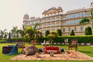 a large building with a blanket in front of it at Noormahal Palace Hotel in Karnāl