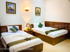 a hotel room with two beds and two lamps at Ravoeun Angkor Boutique in Siem Reap +48 photos