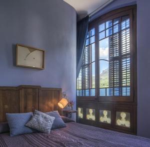 Postel nebo postele na pokoji v ubytování Hotel Monumento Can Garay