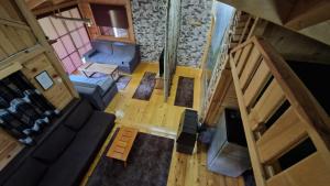 an overhead view of a living room with a couch at Rest House Ripac in Praščijak +55 photos