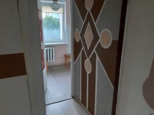 a hallway with a door leading to a room at Independent apartment in varena in Varėna