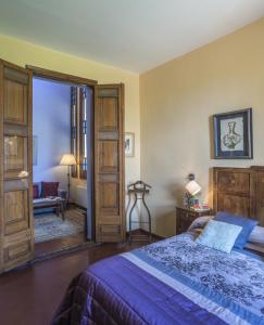 Postel nebo postele na pokoji v ubytování Hotel Monumento Can Garay