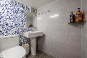 a bathroom with a white toilet and a sink at Memory Stay Seoul Jongro Hanok in Seoul +30 photos