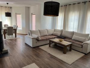 a living room with a couch and a table at Una in Bihać