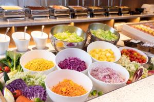 a buffet filled with bowls of different types of vegetables at Hotel JAL City Nagoya Nishiki in Nagoya
